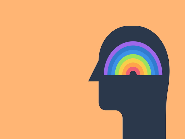 Stilisierter dunkler Kopf mit buntem Regenbogen im Inneren vor orangefarbenem Hintergrund – Symbol für mentale Gesundheit.